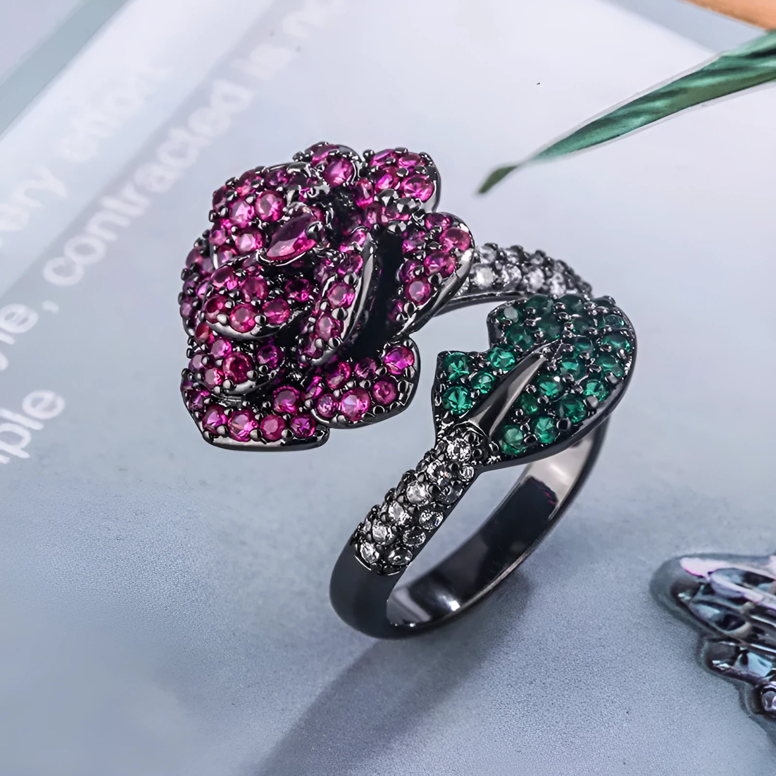 Geometric black gold women's ring with simulated red corundum stone and flower design elements