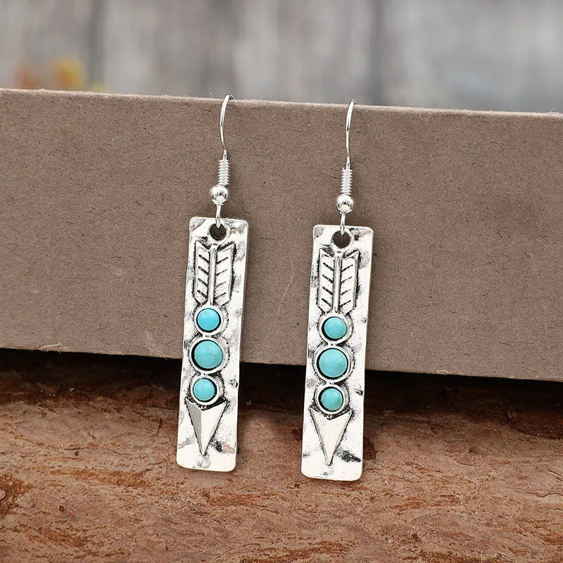 Women's silver geometric retro earrings with inlaid turquoise detailing on long strip design