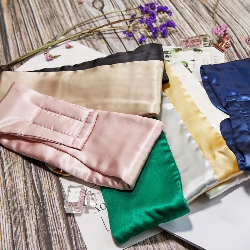 Mulberry silk sleep eye mask shown in one of seven colours: black, champagne gold, green, navy, pink, silver grey, or white.