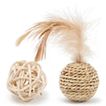 Two cat toys: hollow rattan ball and faux feather ball with bell attachment on neutral background