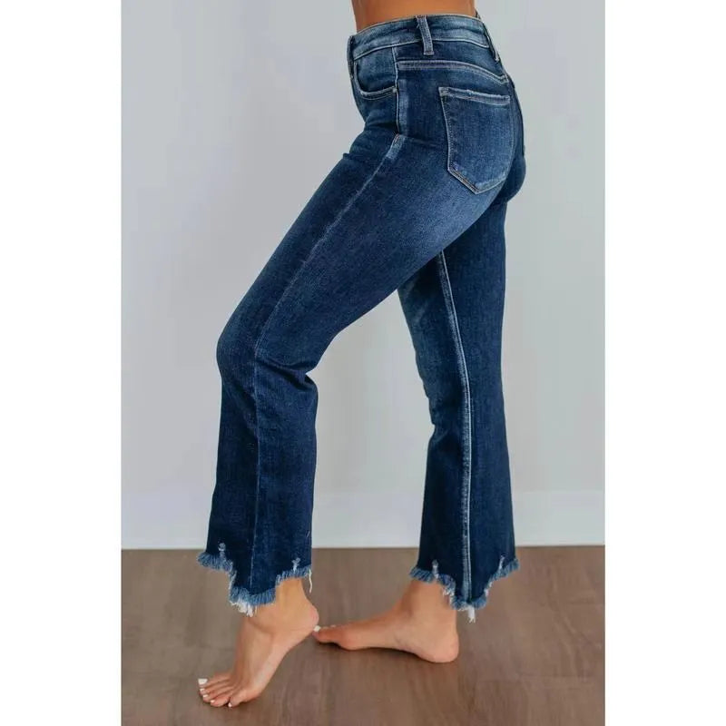 Women's casual denim jeans in solid dark blue with a hand-worn distressed finish.