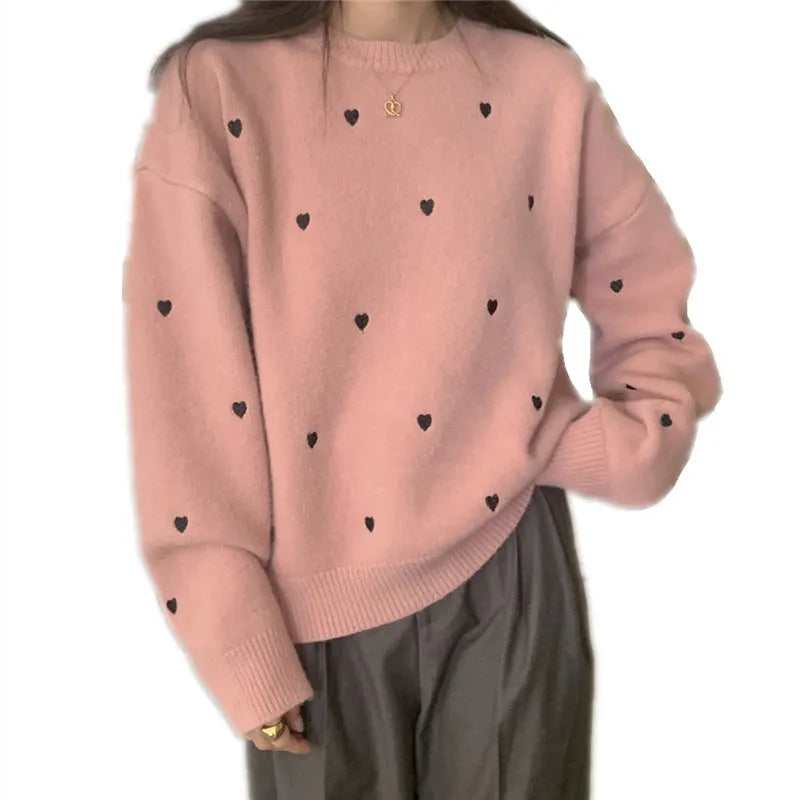 Women's loose grey acrylic pullover sweater with love pattern embroidery on the front.