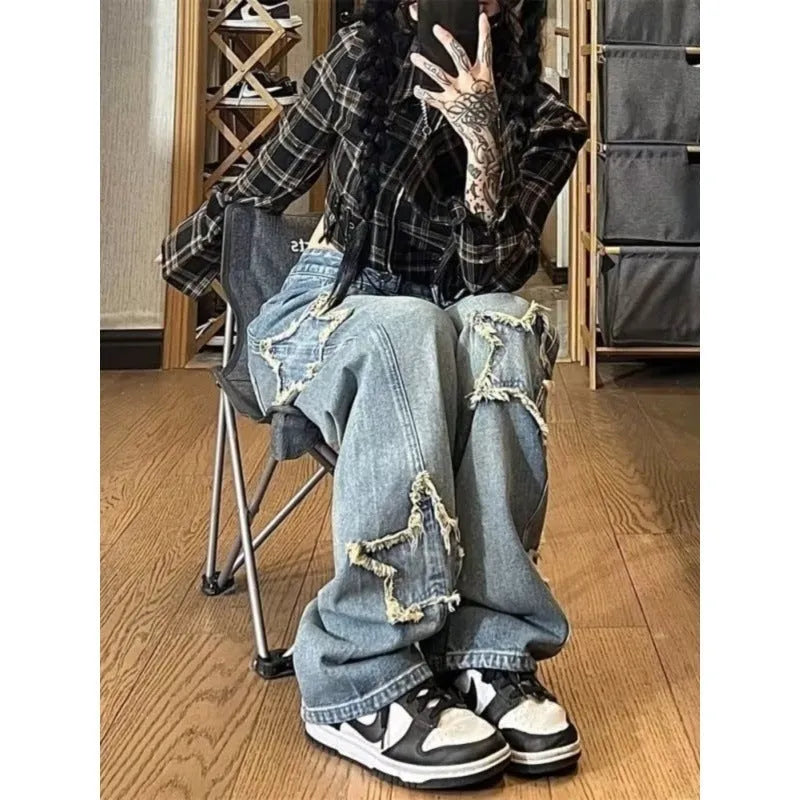 Blue high-waist wide-leg women's jeans on a model, showing the straight-leg cut and denim texture.