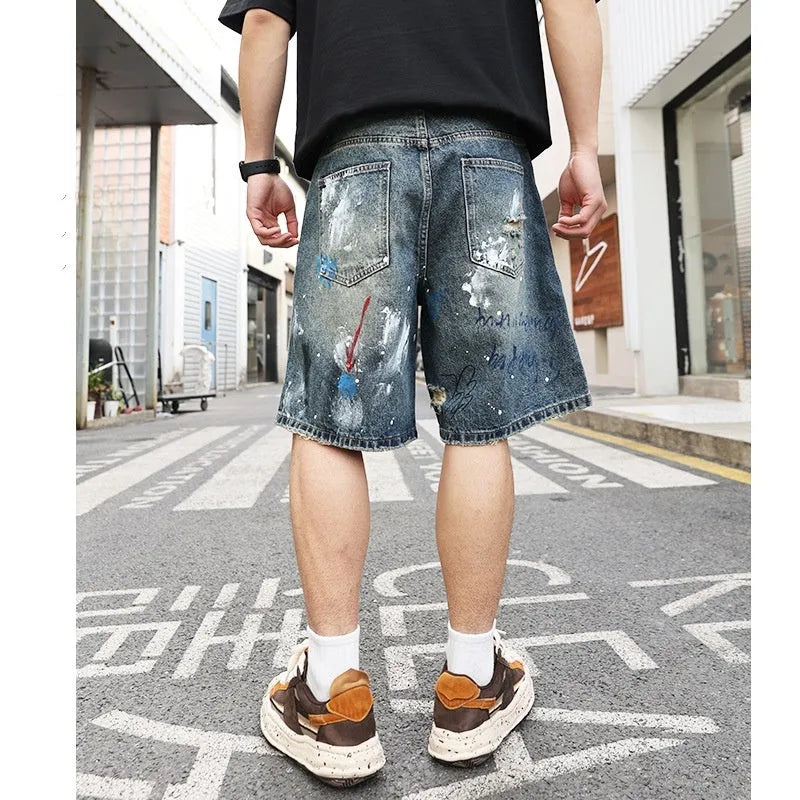 Blue denim shorts for men with ripped detailing and a straight leg cut.