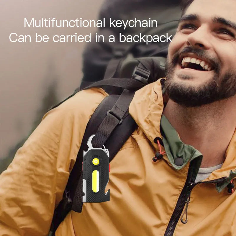 Multifunctional charging emergency light in black with COB and LED panels, mountaineering buckle, and bottle opener