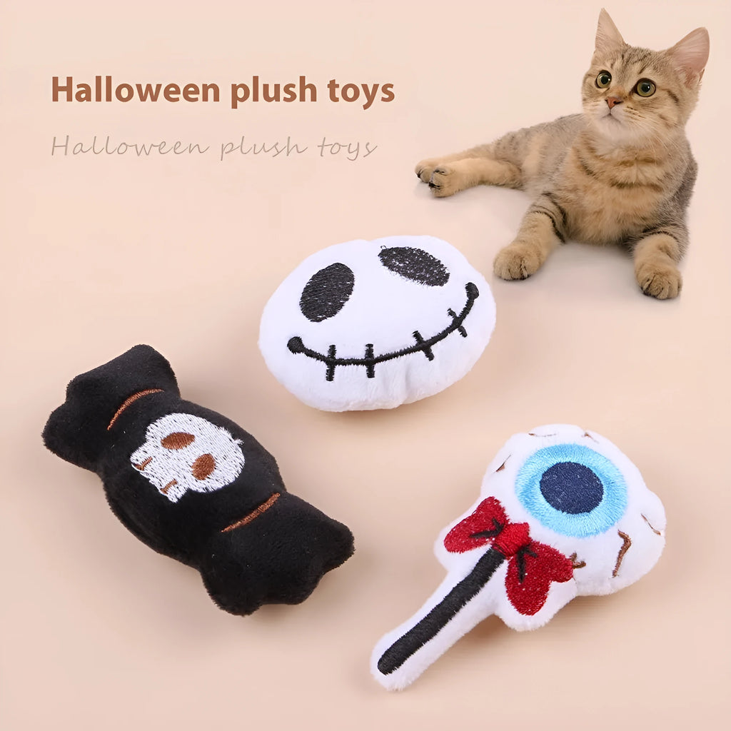 Plush cat teaser toy with long wand handle showing candy and skull designs