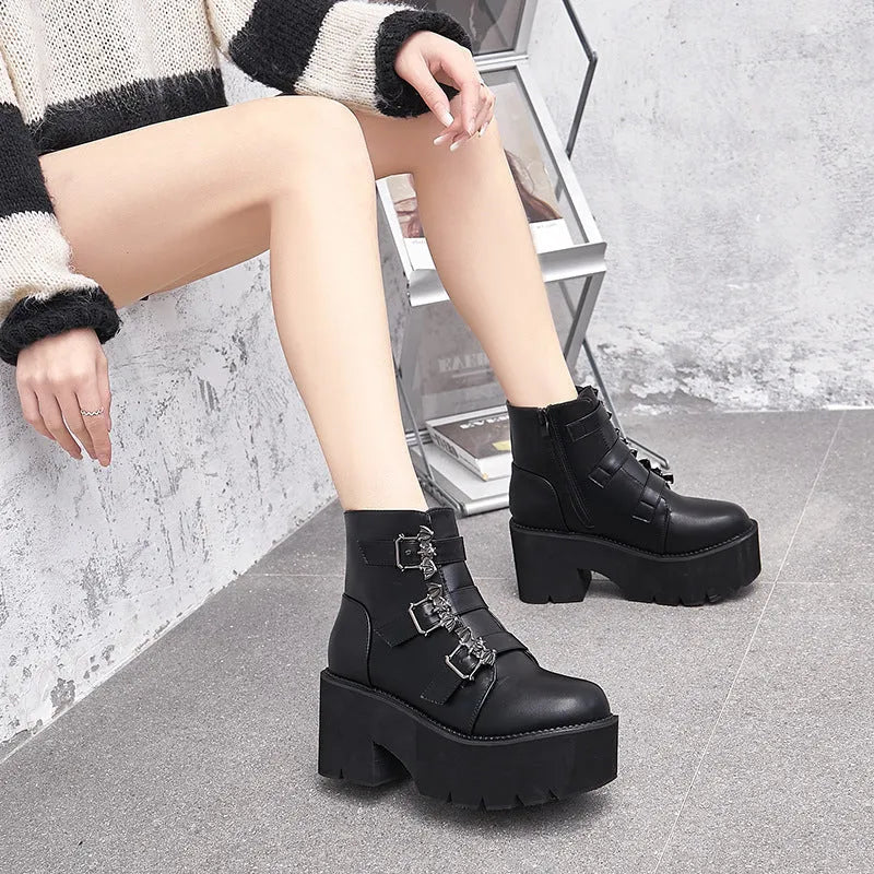 Black women's punk ankle boots with bat buckle decoration and side zip closure