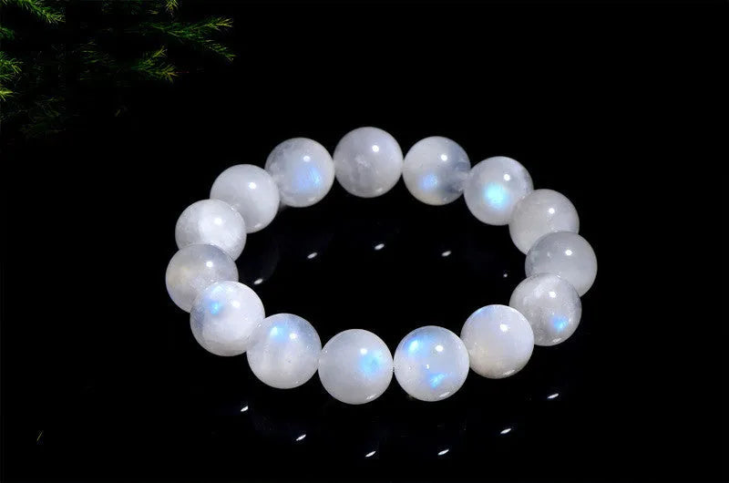Natural blue moonlight moonstone round bead bracelet showing polished stone surface and blue sheen