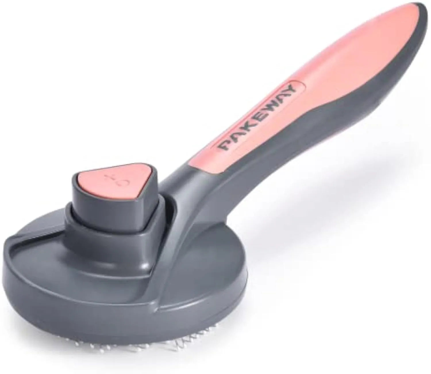 Grey self-cleaning slicker brush for pets with one-click button and comfort-grip handle on a table.