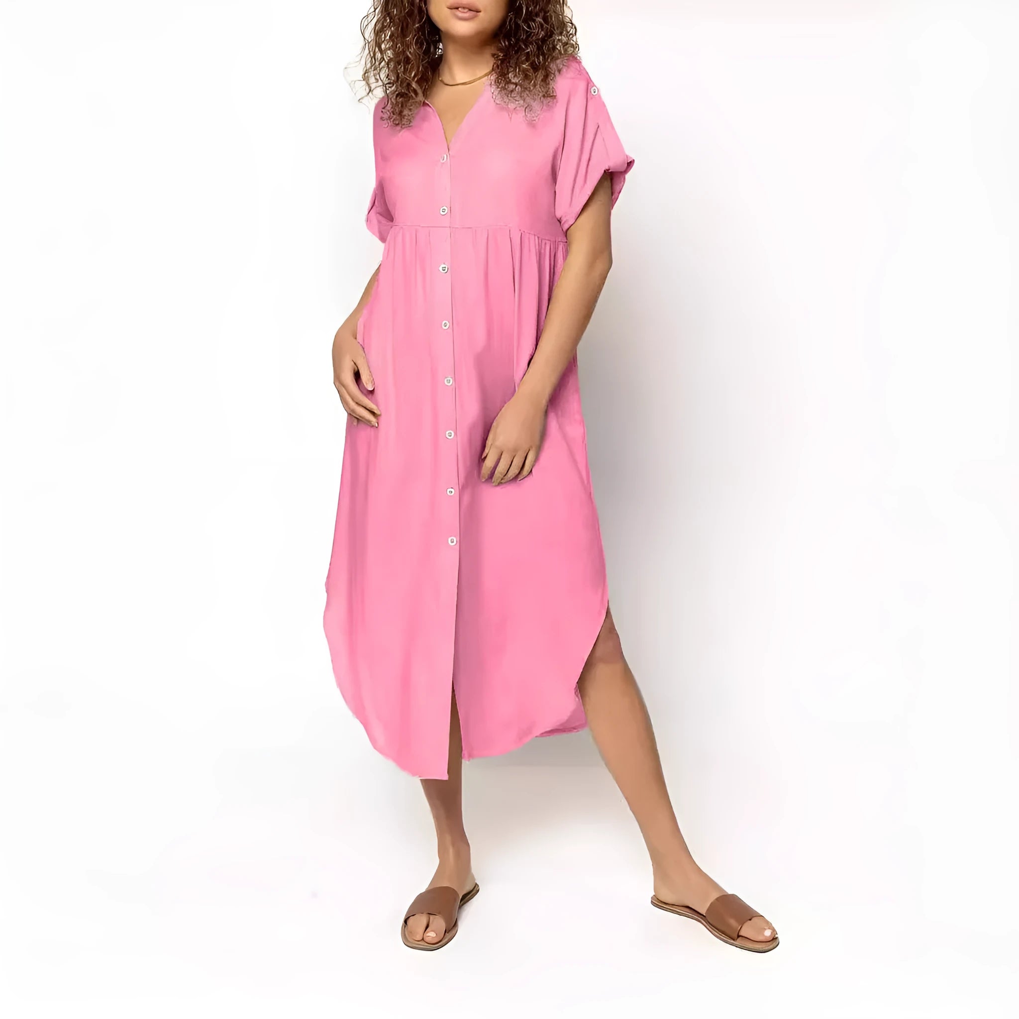 A loose-fitting, mid-length casual dress with a button-down front, shown in a solid colour.