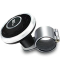 Metal universal steering wheel assist ball with steel ball bearing in silver finish mounted on a car steering wheel for one-handed control