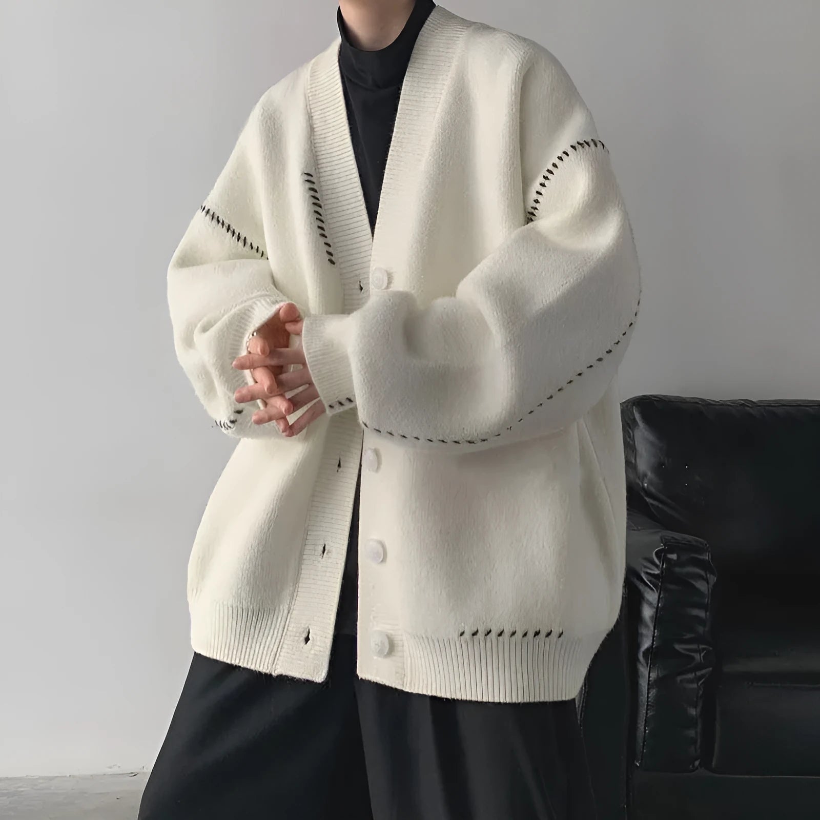 Women's loose fit long sleeve knitted cardigan coat in black or white