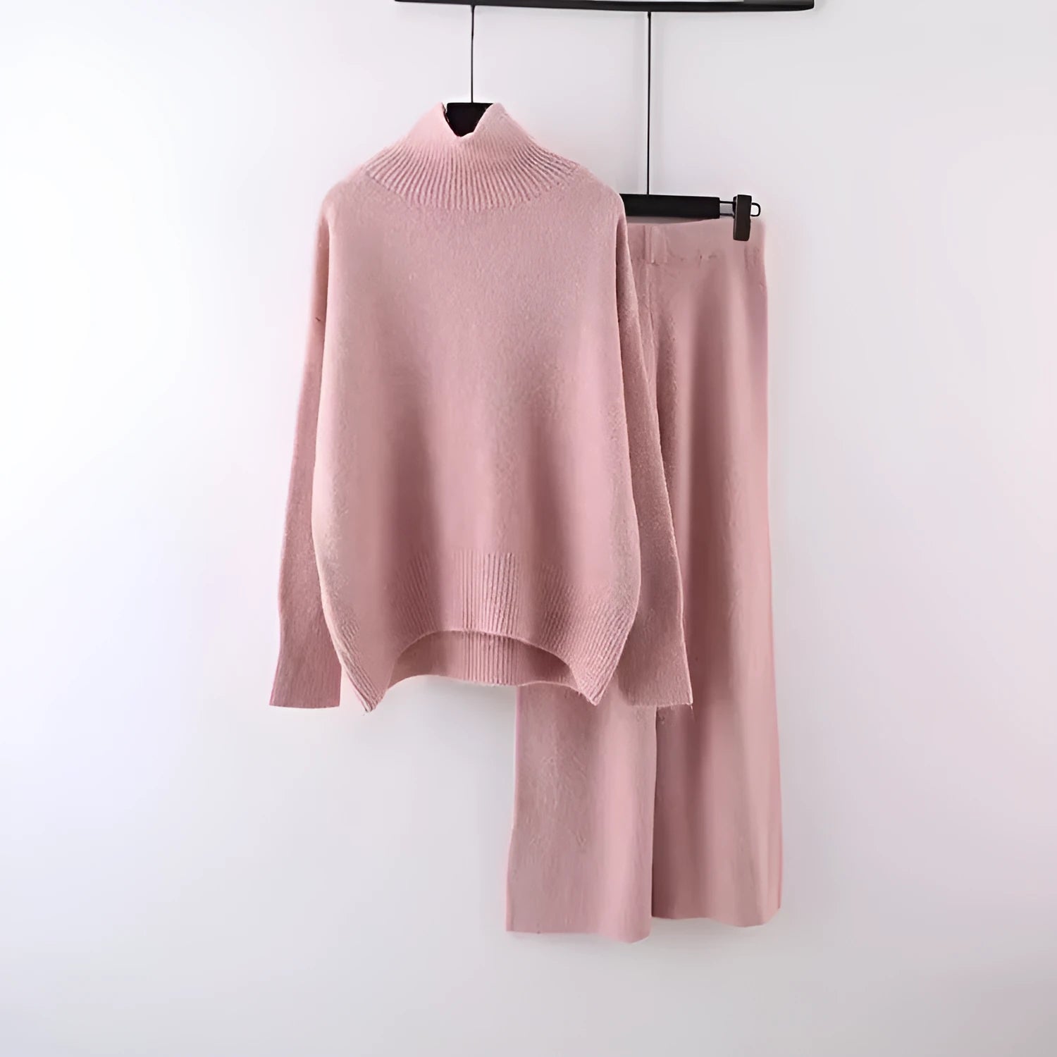 Women's casual two-piece set with long sleeve sweater and wide leg trousers in a solid colour.