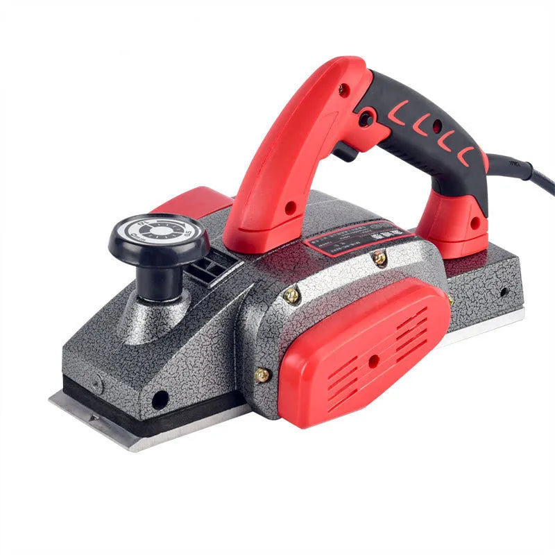 Red aluminium-shell electric wood planer with 82mm planing width on workbench