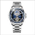 Silver alloy automatic mechanical watch with blue dial and stainless steel strap on wrist