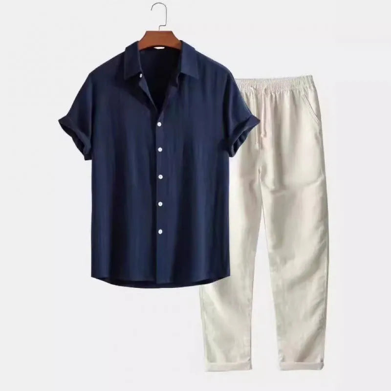 Man wearing a loose-fit light blue linen-blend short sleeve shirt and matching casual trousers.