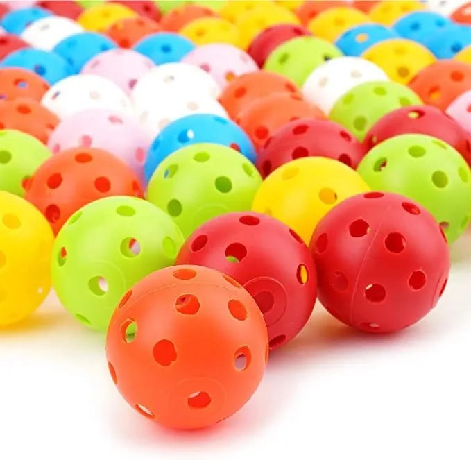Six different coloured golf practice balls showing red, orange, blue, green, white and yellow variations with net bag packaging