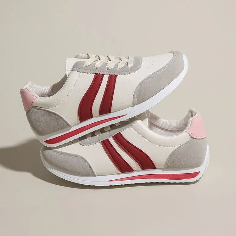 Red and blue lace-up low-top running sneakers with a PU mesh upper and flat rubber sole.