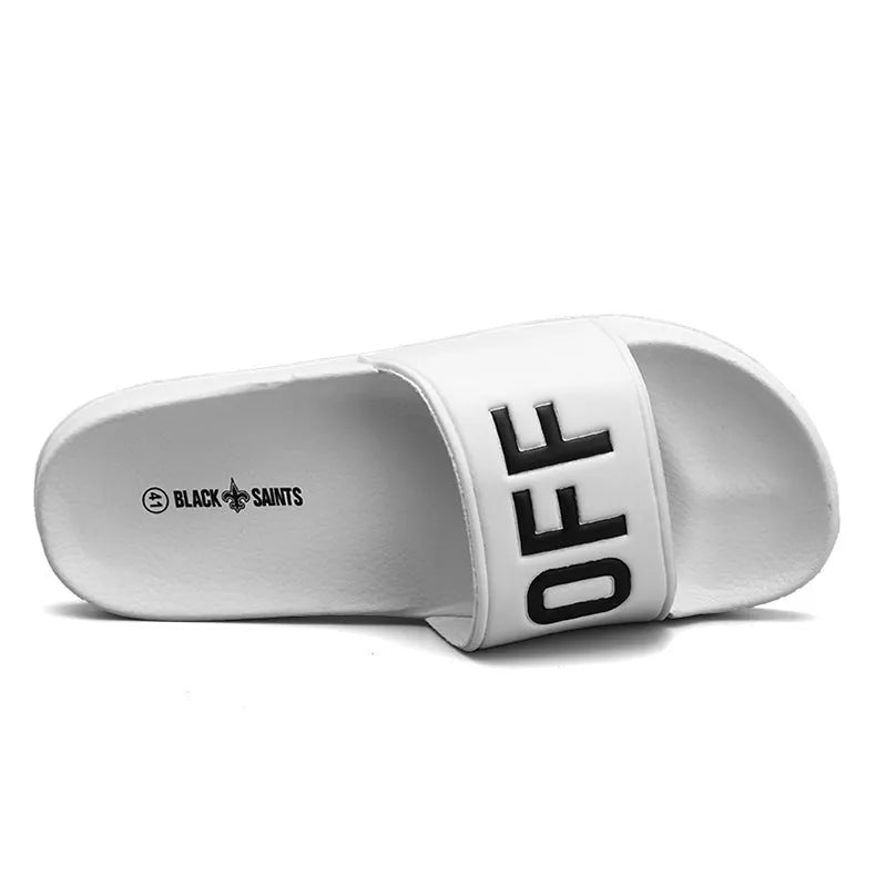 Men's black and white open toe slippers with a rubber sole, shown in large sizes.