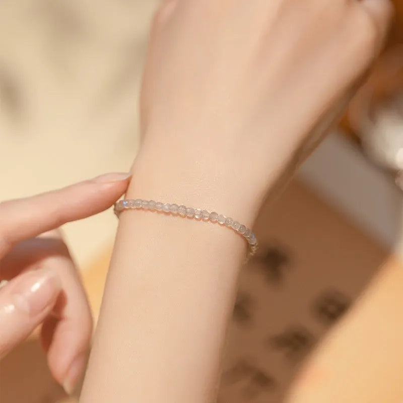 Natural gray moonstone diamond-shaped beads on a silver bracelet with clasp