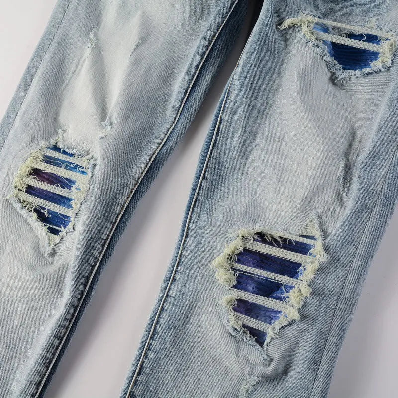 Bright white washed distressed cat beard patch ripped slim straight leg mid waist jeans cotton denim