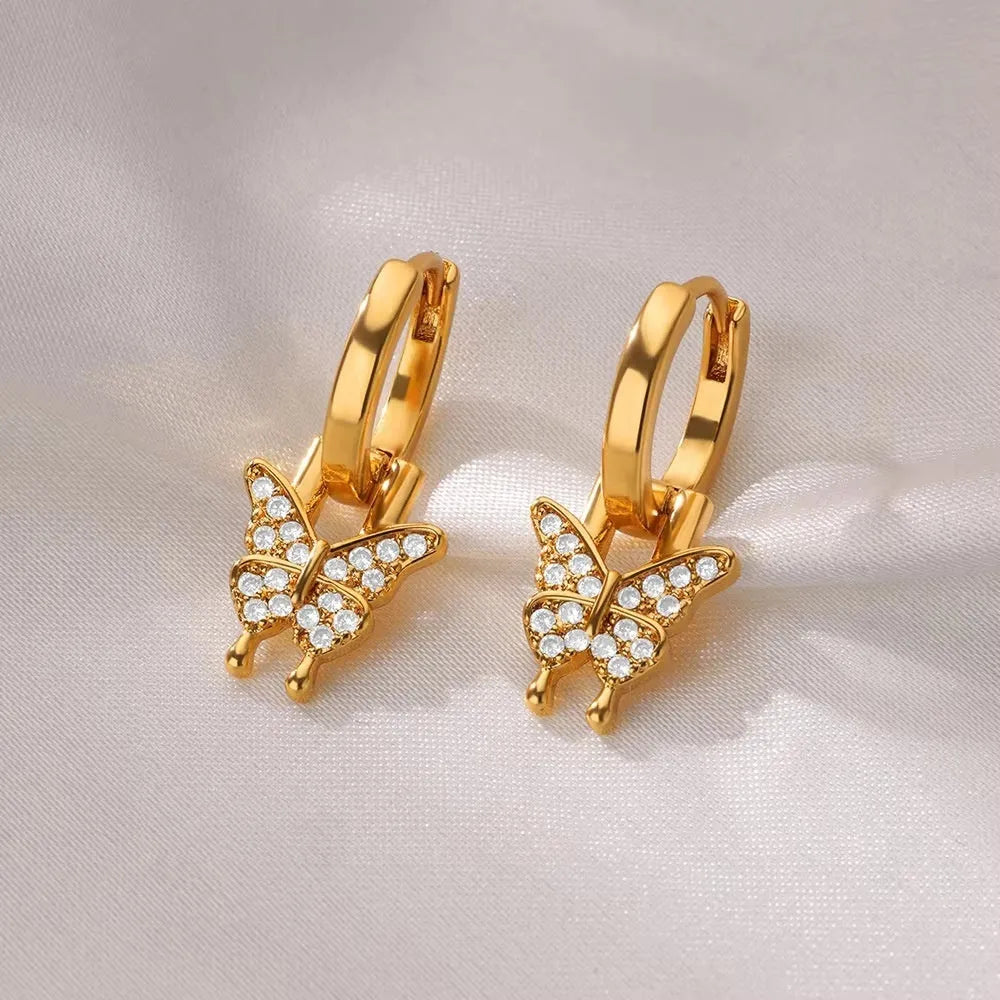 Women's geometric butterfly earrings with heart, star, and bow designs in copper with diamond treatment