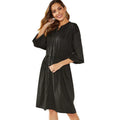 Black polyester A-line midi dress with elastic waist and long sleeves displayed front view