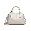 Women's large capacity square shoulder bag in neutral colour with interior phone and file pockets.