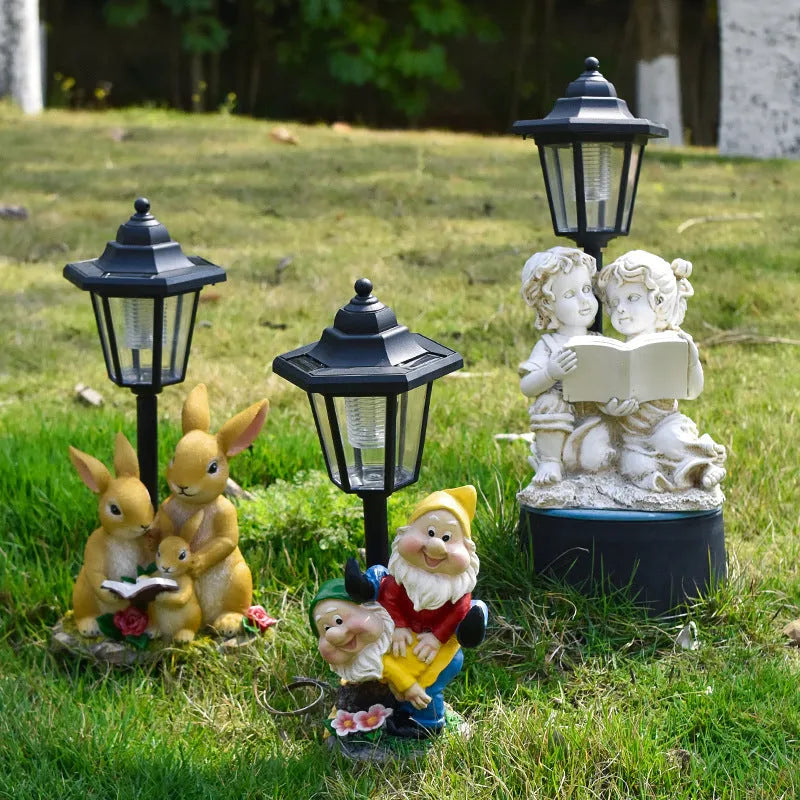 Decorative hexagonal solar garden lamp with animal sculpture design on patio.