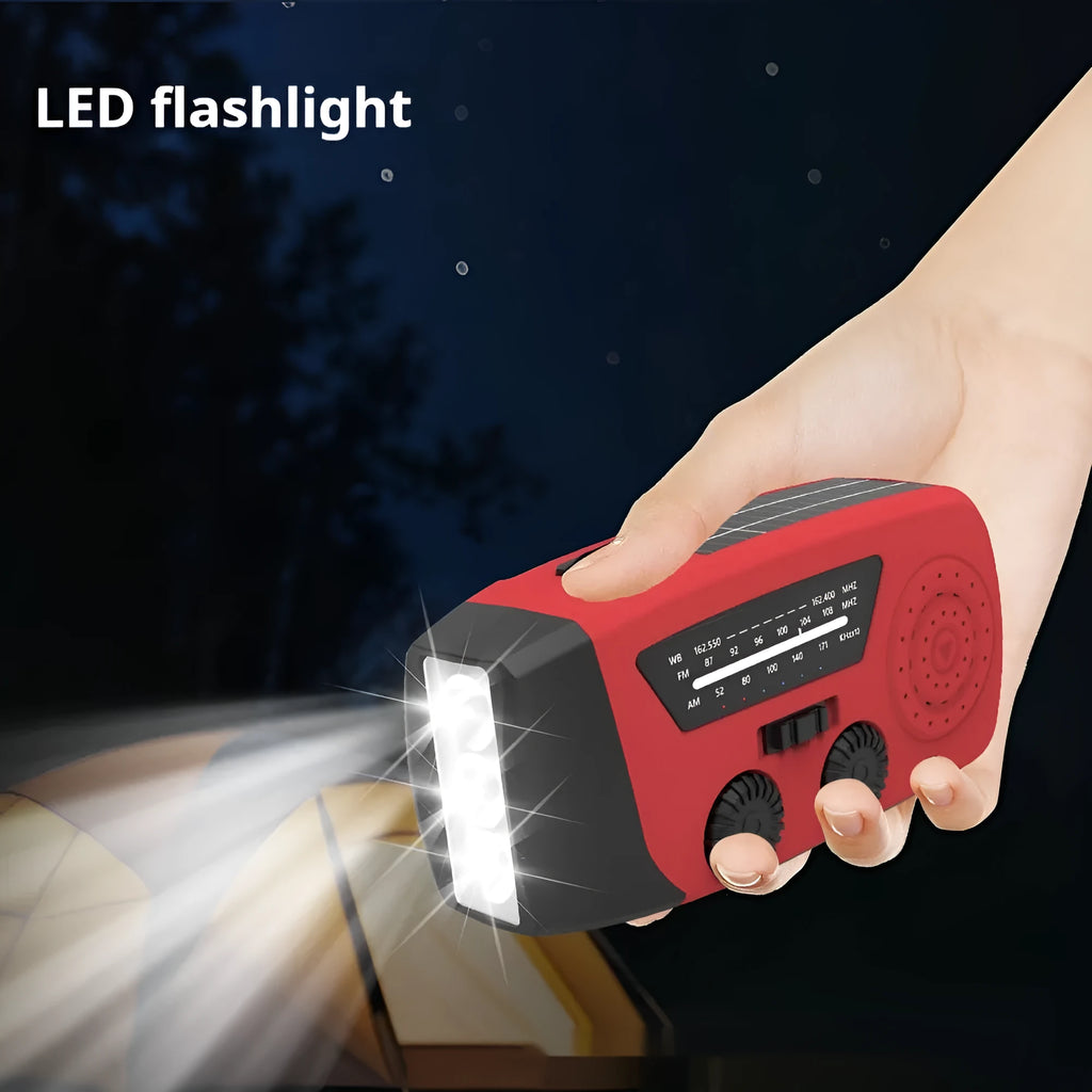 Red rechargeable hand radio torch with built-in speaker and USB interface, compact ABS body, emergency disaster prevention device