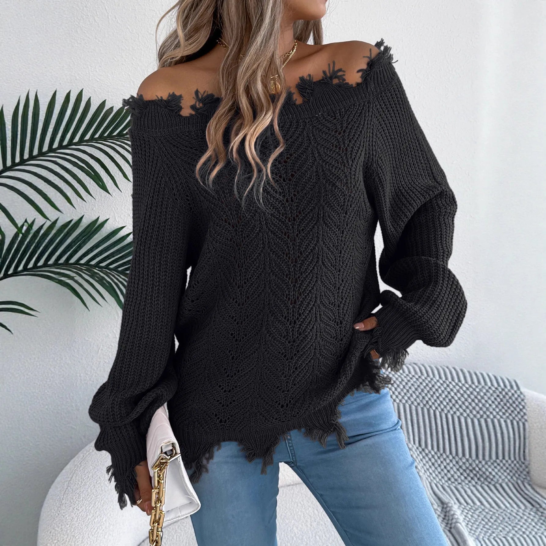White cut off-the-shoulder pullover sweater with hollow-out long sleeves and street fashion styling