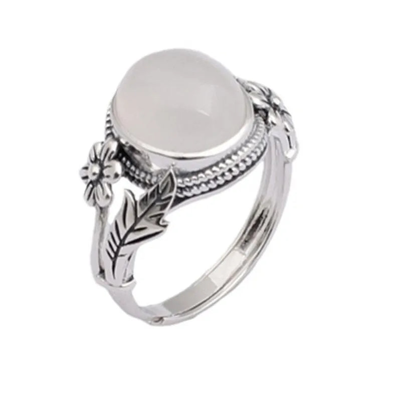 Copper vintage ring with imitation white chalcedony stone and adjustable U-shaped open design.