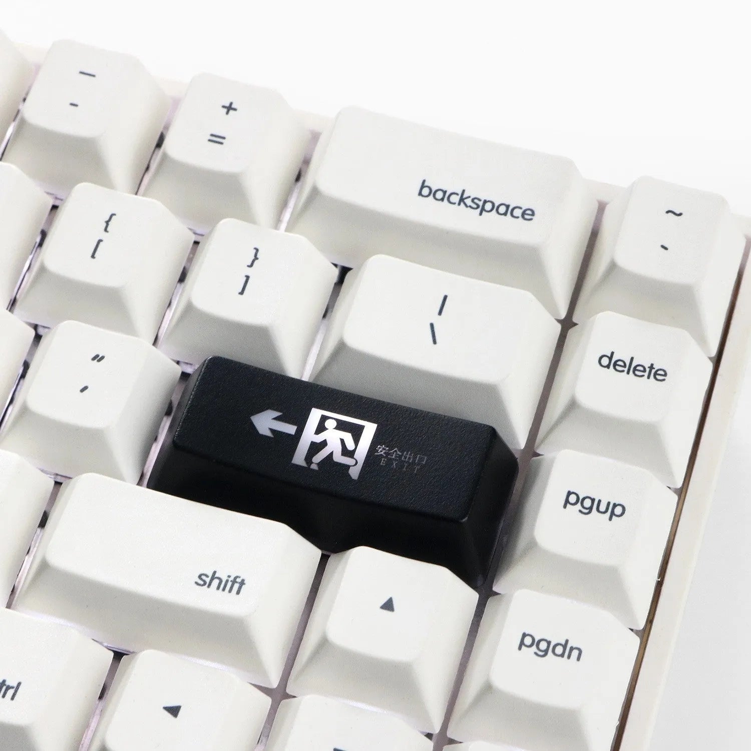 Red safety evacuation exit key cap on a keyboard, backspace style