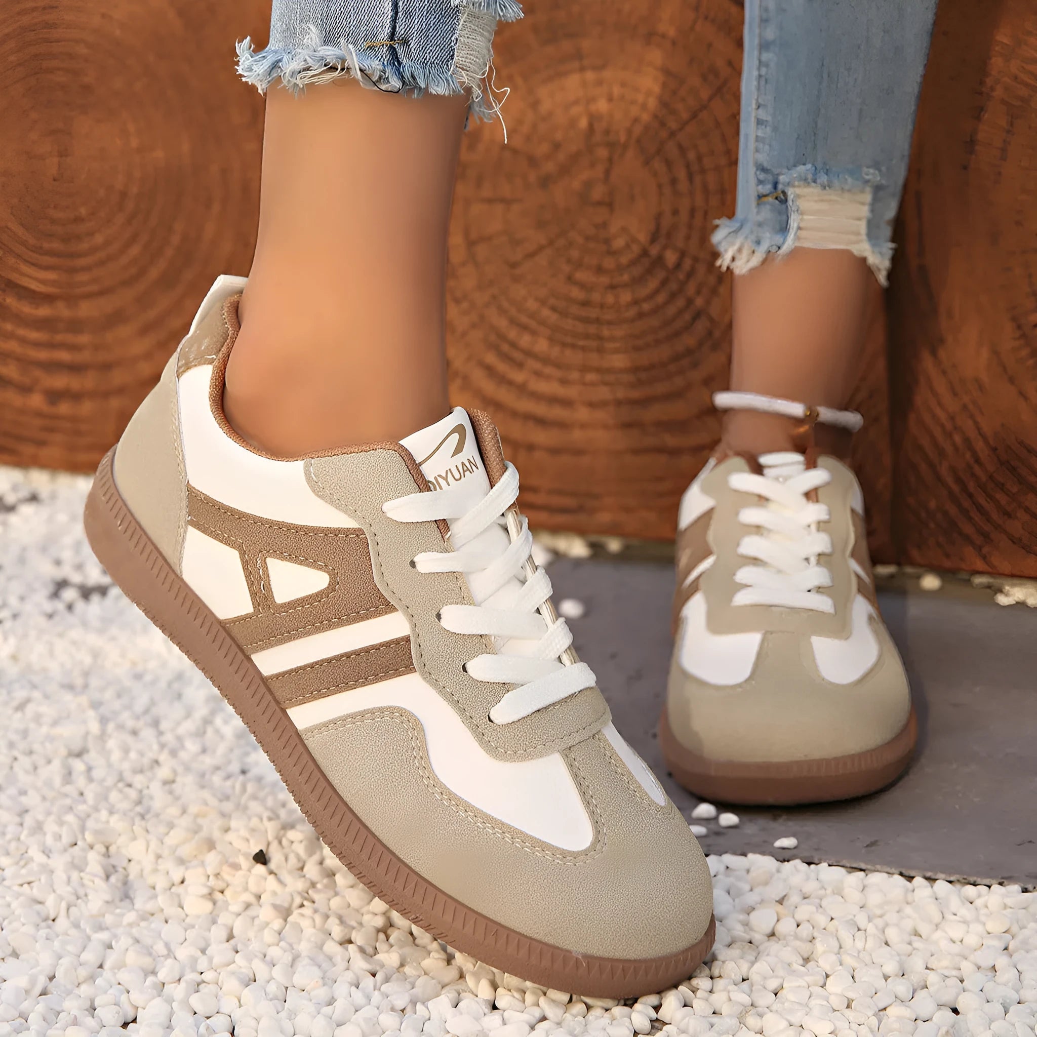 Retro colour-matching lace-up lightweight women's jogging shoes in black, side view showing low top and platform sole