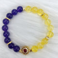 Handmade women's amethyst crystal bracelet with yellow and purple colour tones