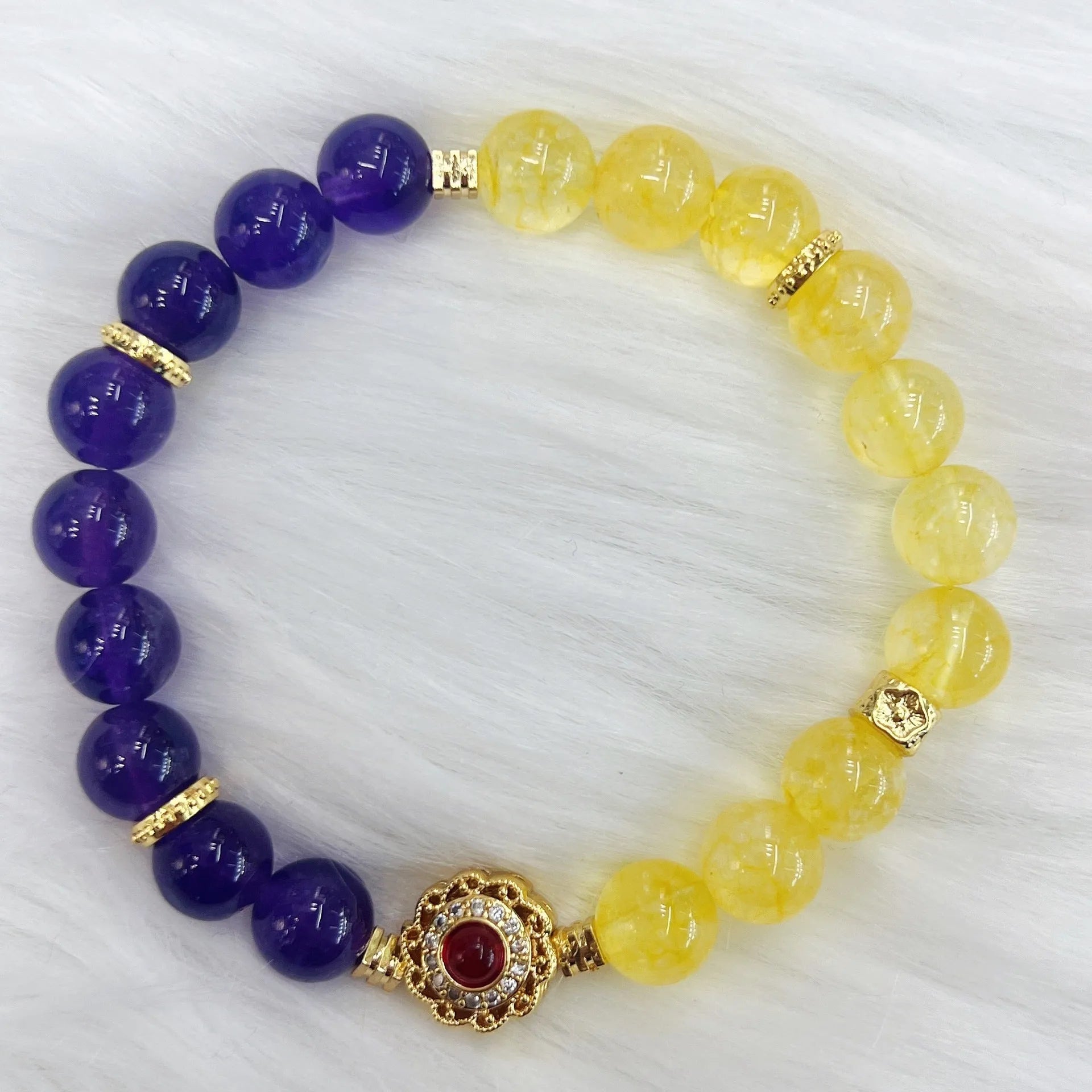 Handmade women's amethyst crystal bracelet with yellow and purple colour tones