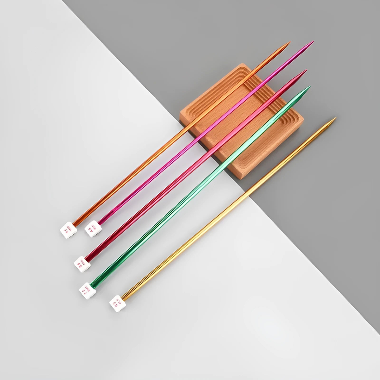 Set of lengthened crochet hooks in thirteen sizes from 2.0mm to 10.0mm, each with a protective end cap.
