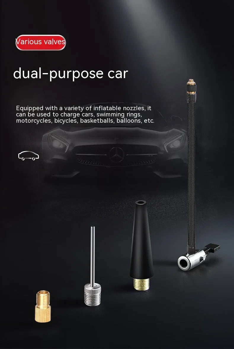 Red and black portable wireless car tyre air pump with power cable and nozzle attachments on a table.
