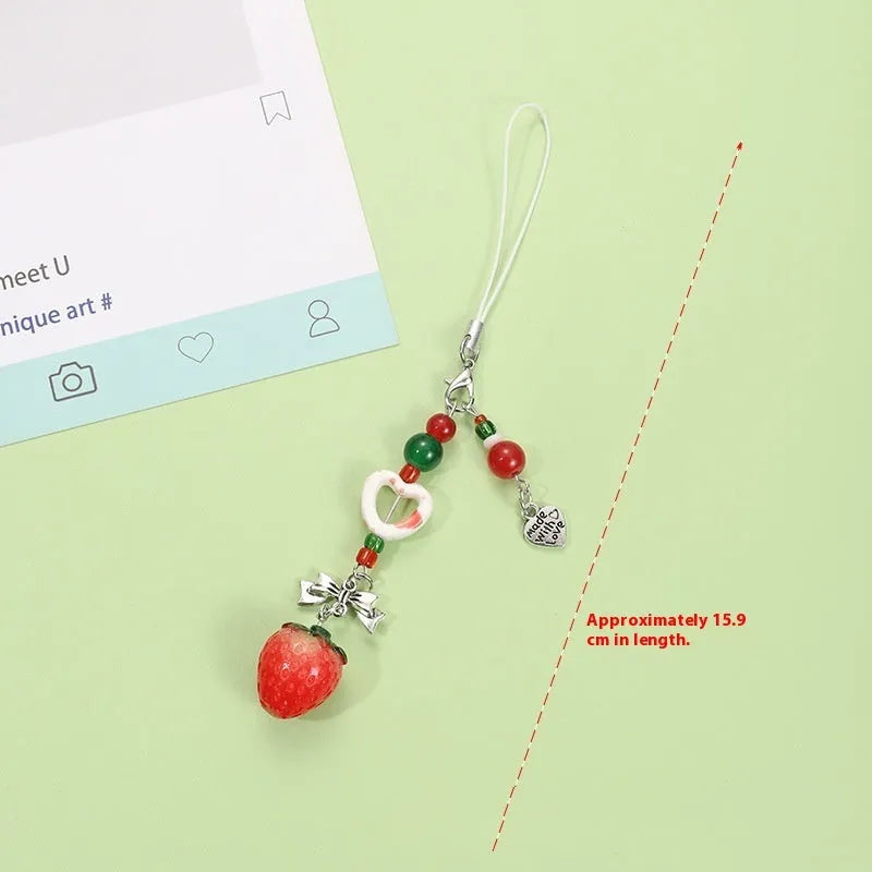 Mobile phone earphone bag pendant keychain with fruit designs including apple, strawberry, and apple core patterns