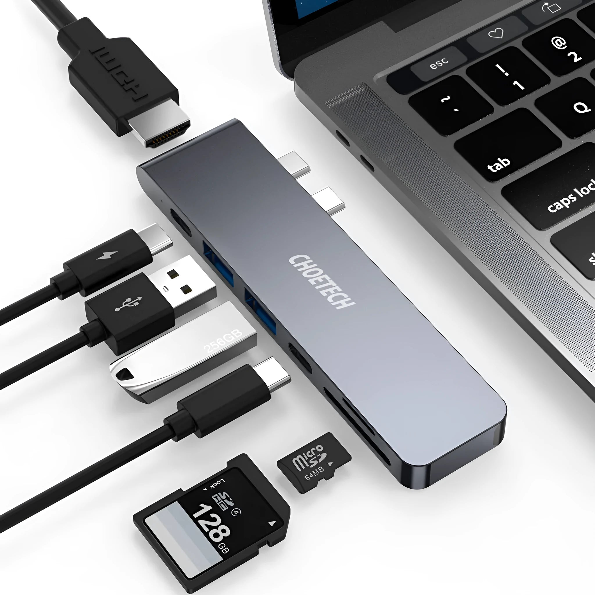 Silver aluminium USB-C 7-in-1 hub adapter with SD card, Micro SD, HDMI, USB 3.0, and Power Delivery ports.