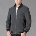 Men's grey polyester fleece sports jacket with long sleeves and a pocket, shown on a hanger.