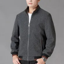 Men's grey polyester fleece sports jacket with long sleeves and a pocket, shown on a hanger.