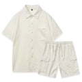 Women's beige polyester shorts set with short sleeve top and elastic waist shorts laid flat.