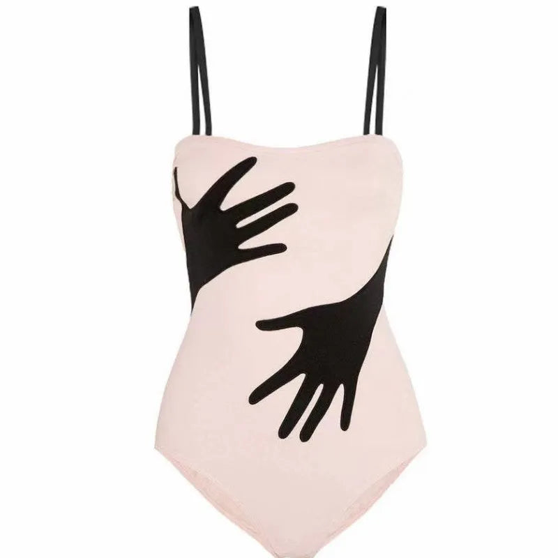 Women's one-piece bikini swimsuit with a gauze skirt overlay.