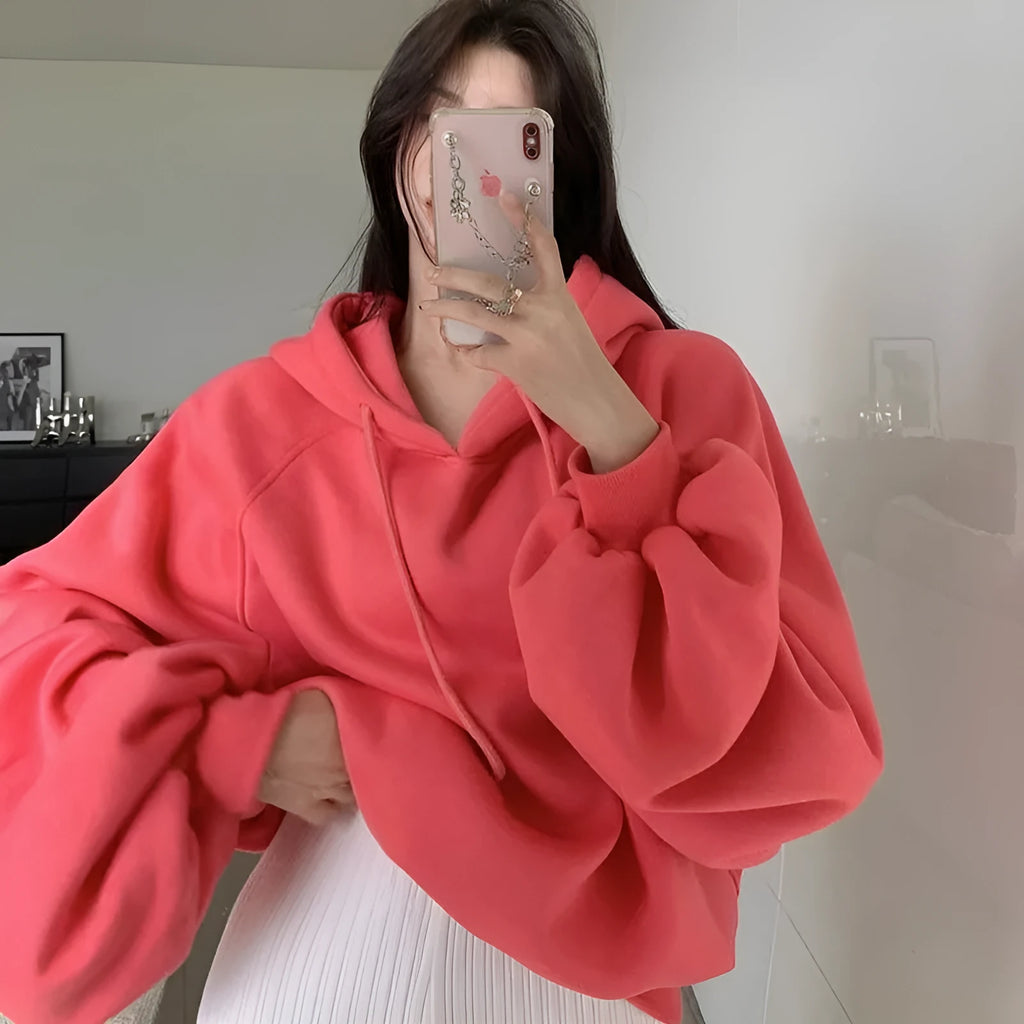 Watermelon red sleeveless women's hooded sweater made from mulberry silk, shown on a hanger.