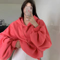 Watermelon red sleeveless women's hooded sweater made from mulberry silk, shown on a hanger.