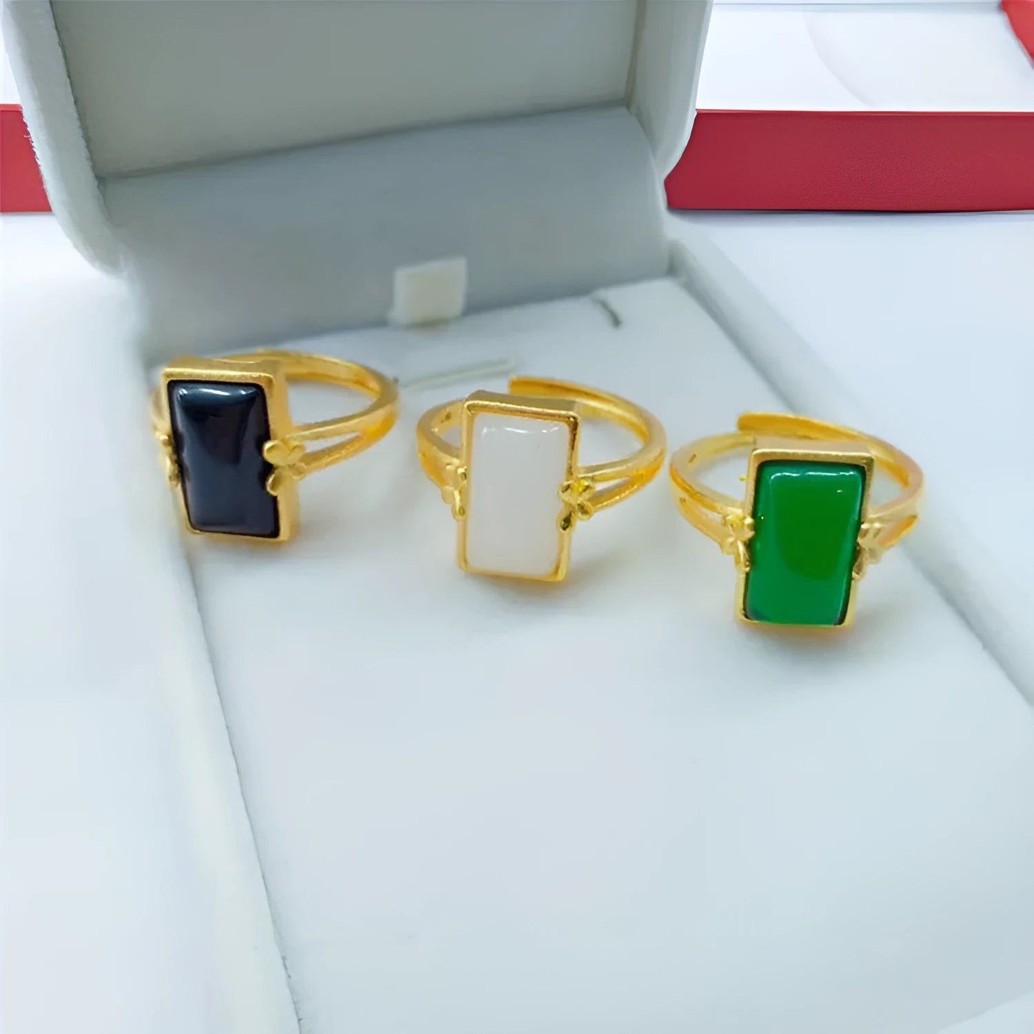 Adjustable brass ring with gold-plated finish and electroplated gemstone inlay
