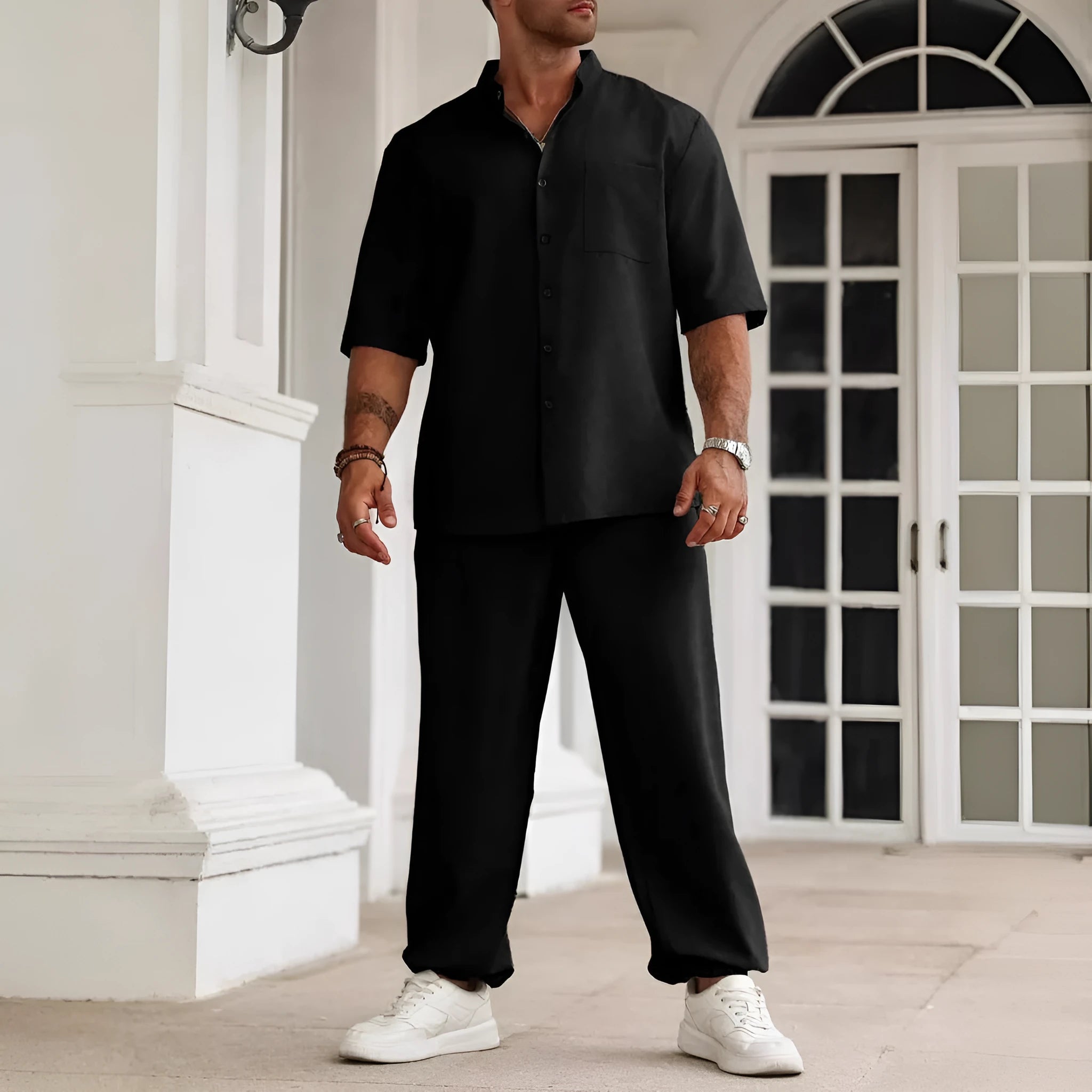 Men's apricot coloured cotton linen casual short-sleeved shirt and trouser set laid flat.
