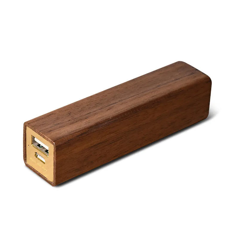 Portable black walnut solid wood power bank with 2000mAh 18650 battery, 100mm length, brown colour, on light background