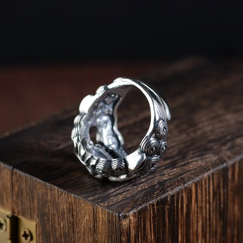 Silver open style ring with detailed jibeast animal pattern and diamond accents